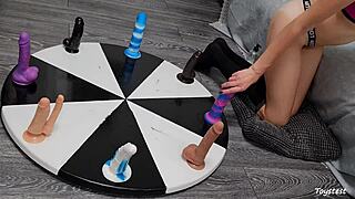 Wheel of dildos she wants to win her orgasm here