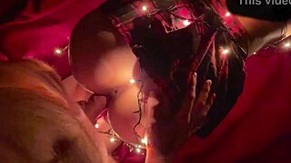 Girl in christmas lights receives santa's gift