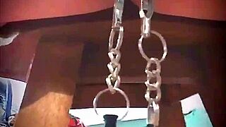 Big pink pussy lips dangled and stretched down with weights.