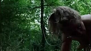 forest humiliation session with bound slave in natural outdoor setting