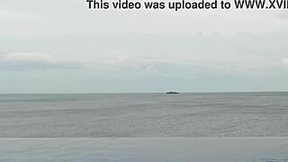 relaxing by the infinity pool