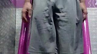 Black Brunette Uses Fitness Machine for Intense Gym Workout