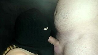 My step sister's hot mouth sucks the cock while her face is hidden by a balaclava