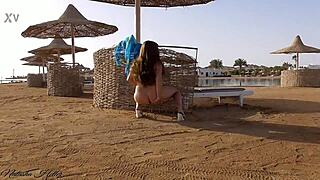 I go without panties on a public beach, flashing my big tits