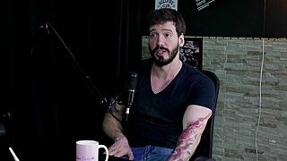 Arthur Aily in sheer red lingerie, exploring pain and inversion during group play