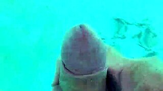 i jerk off naked in the pool, feeling the water around me