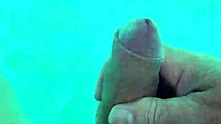 i jerk off naked in the pool, feeling the water around me