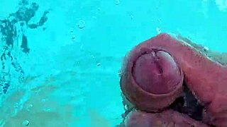 i jerk off naked in the pool, feeling the water around me
