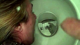 Slave endures public urinal humiliation