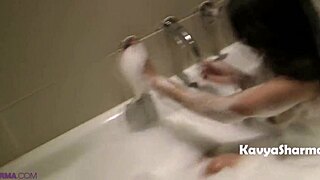 indian housewife taking a relaxing shower in the bathroom.