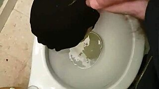 Slave endures public urinal humiliation