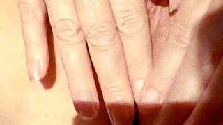 Early morning, this mature woman spreads her shaved pussy for masturbation