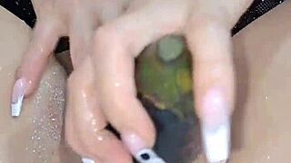 sexy colombian girl fingers her pussy and fucks it with a large eggplant