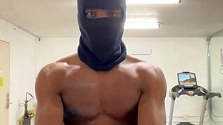 Black bodybuilder works out neck and shoulders outdoors in California for ladies.