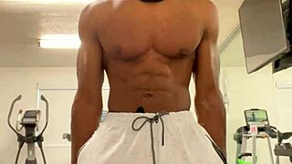 Black bodybuilder works out neck and shoulders outdoors in California for ladies.