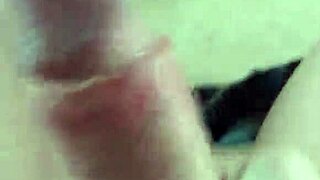 at home alone, I stroke my big cock slowly, feeling every inch