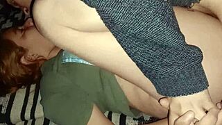 What does the emo couple do in missionary with the cell phone beside?