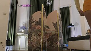 Beautiful brunette babe tries on lingerie and mini skirts backstage for a haul day