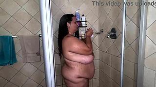Bbw flaunts huge tits and ass in soapy shower