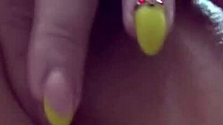 The milf gently caresses her anal area, then reveals her pussy inside and pees.