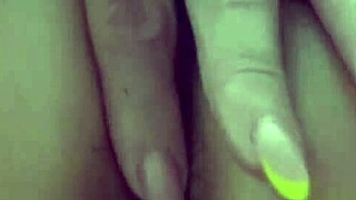 The milf gently caresses her anal area, then reveals her pussy inside and pees.