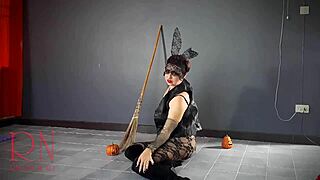 Halloween witch regina noir performs in old house