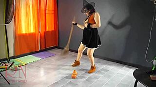Halloween witch regina noir performs in old house