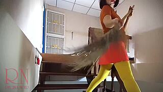 Halloween witch regina noir performs in old house