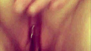 close-up view of a pierced shaved pussy peeing in amateur homemade compilation