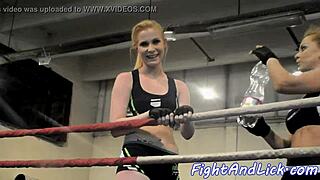 muscular women engage in intense wrestling match inside a boxing ring