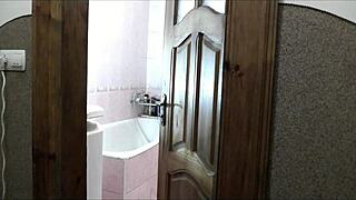 Does this naked sexy blonde in the bathroom notice her pervert roommate watching her masturbate and cum?