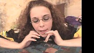 Curly glasses girl rides dildo deep in homemade play