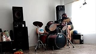 Drum beats make her strip teasingly, shaking huge ass seductively for viewers
