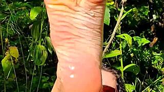 Intriguing Barefoot Milf Strips in Forest Backstage