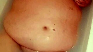 chubby wife naked pussy plays wet in bathtub closeup