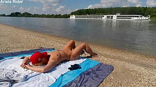 Ariela Rider flashes shaved pussy and rides cock publicly on Danube bank