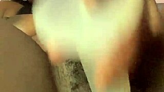 ebony babe spreads creamy shaved pussy lips wide on bed