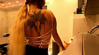 hot tattooed blonde coed flashes meaty pussy and sexy ass in kitchen miniskirt tease