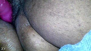 this sexy ebony bbw spreads her hairy pussy wide playing with vibrator on those big tits