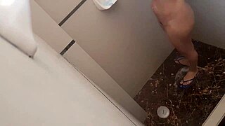 Petite Colombian cuñada showers unaware until she notices voyeur gaze