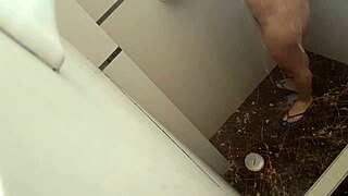 Petite Colombian cuñada showers unaware until she notices voyeur gaze
