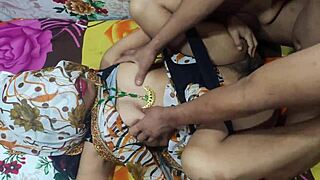 Indian Aunty in Saari Shows Off Big Boobs and Ass in Bedroom Tease