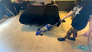 Brunette milf housewife vacuums bedroom in tight skirt showing natural tits