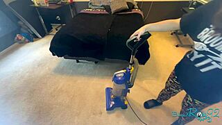 Brunette milf housewife vacuums bedroom in tight skirt showing natural tits