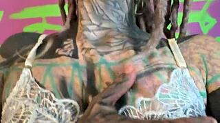 tattooed goth girl strips lingerie fingers shaved pussy and dirty talks in german while riding dildo