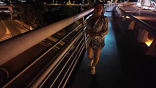 hey check this busty milf strutting braless on the bridge no panties flashing pussy