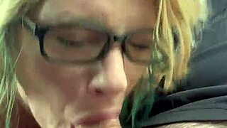 Pretty glasses hooker sucks cum deep in public car blowjob