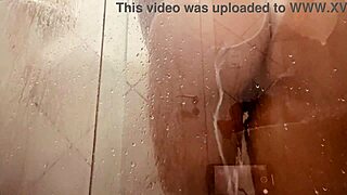 she spreads her legs in the bathroom, washing that huge hairy pussy lips and big clit slow