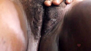 schoolgirl spreads legs fingering her huge pussy lips close up