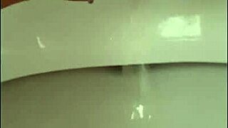 close up shaved pussy pisses wet with pierced clit outdoors